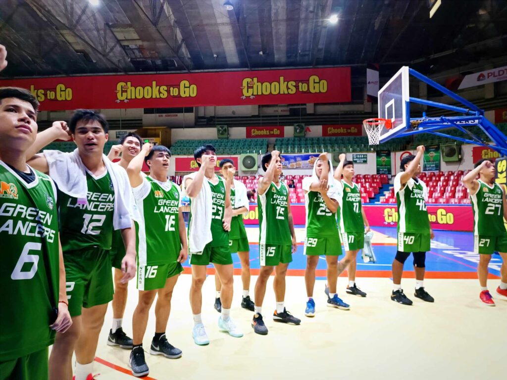 UV Green Lancers players singing their school hymn after beating the CRMC Mustangs in the Cesafi men's basketball tournament. | Glendale Rosal