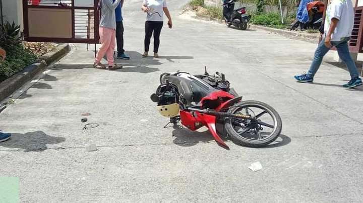 The motorcycle of the visitor lies on its side after the security guard shot the visitor for defying subdivision’s policy on not allowing visitors wearing shorts or short pants to enter the subdivision in Barangay Sta. Cruz, Liloan town in northern Cebu on November 4. | Contributed photo
