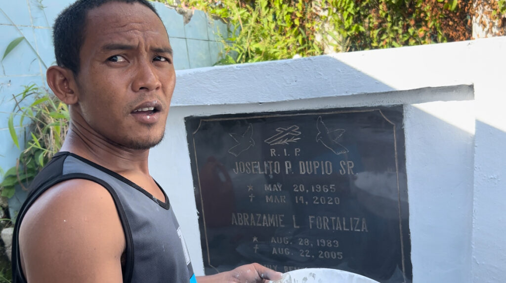Kalag-Kalag panata: A young man's promise to his departed loved ones. In photo is Jonathan Dupio, who promises to clean the tombs of his loved ones as a pledge or promise or panata during the Kalag-Kalag.