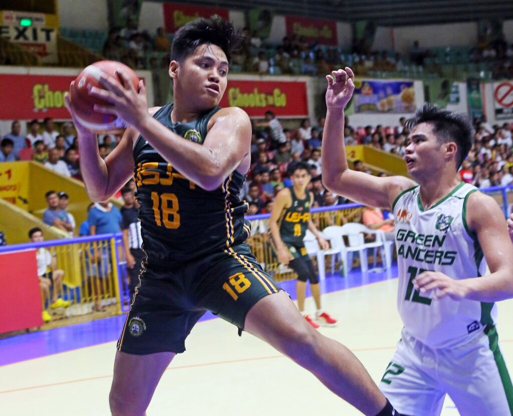 USJ-R’s EJ Agbong grabs a rebound during their game in the Cesafi against the UV Green Lancers.
