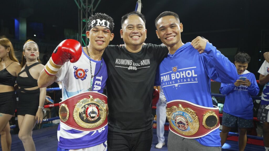 Floriezyl Echavez Podot of PMI Boxing Promotions (middle) along with boxers Regie Suganob (left) and Christian Balunan (right).