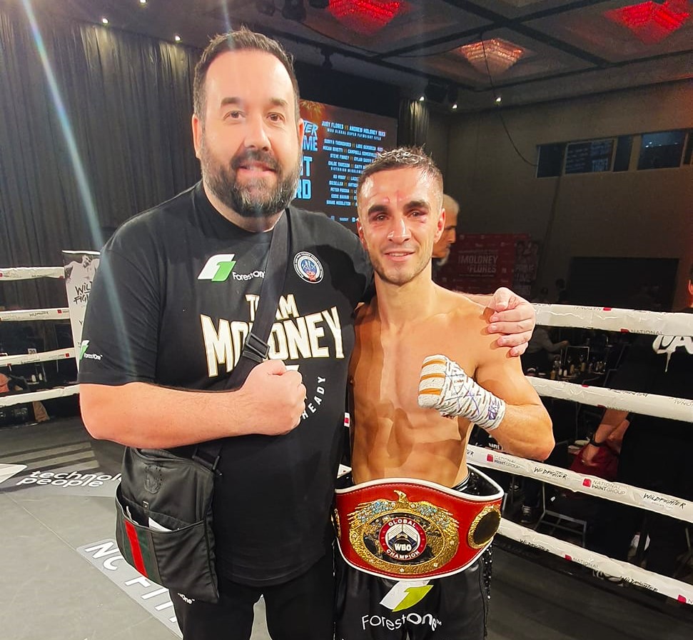 Andrew Moloney (right) poses with his manager Tony Tolj after his win against Filipino, Judy Flores.