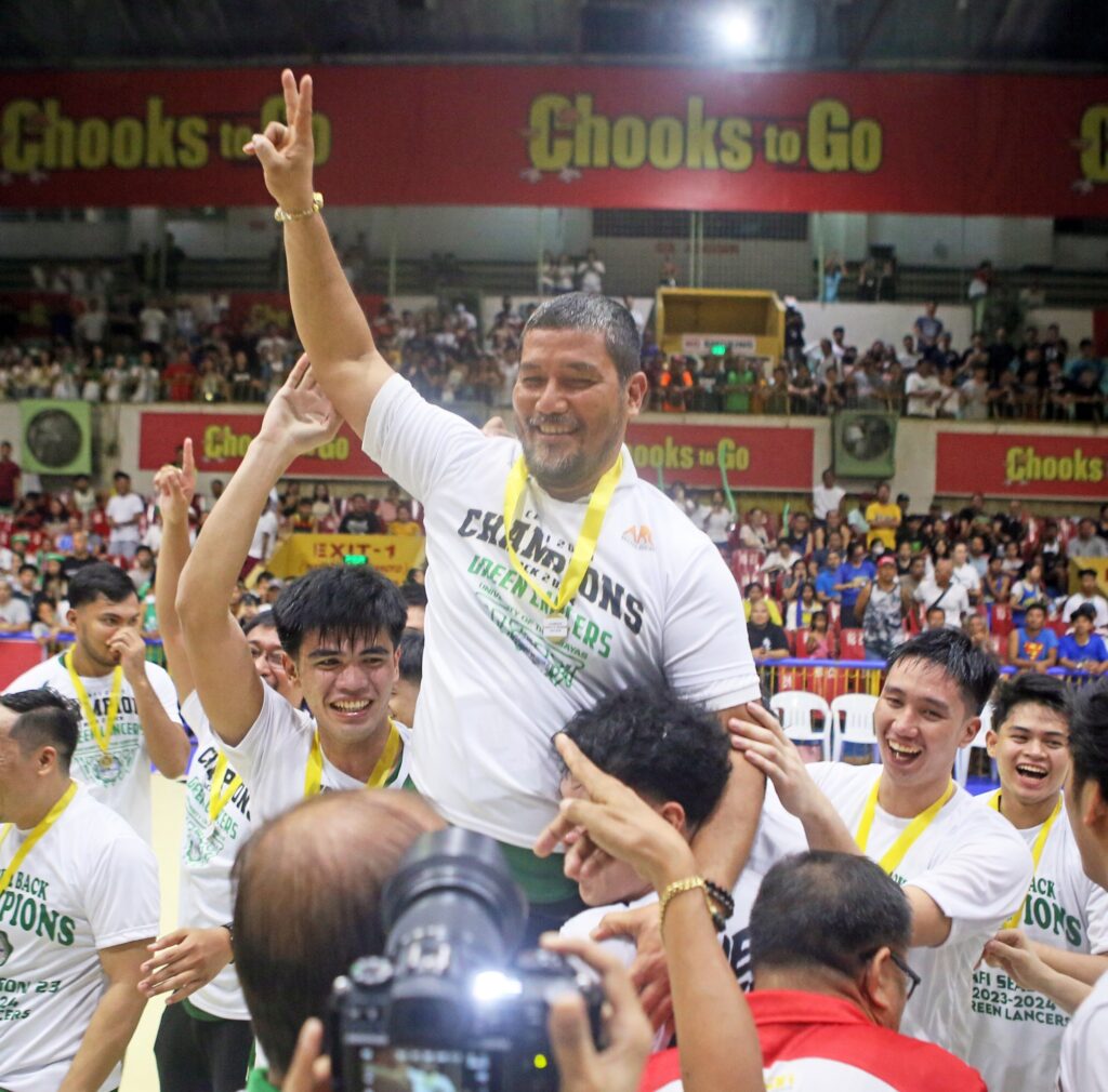 Coach Gary Cortes celebrate with the UV Green Lancers after winning their 15th Cesafi men's basketball title.