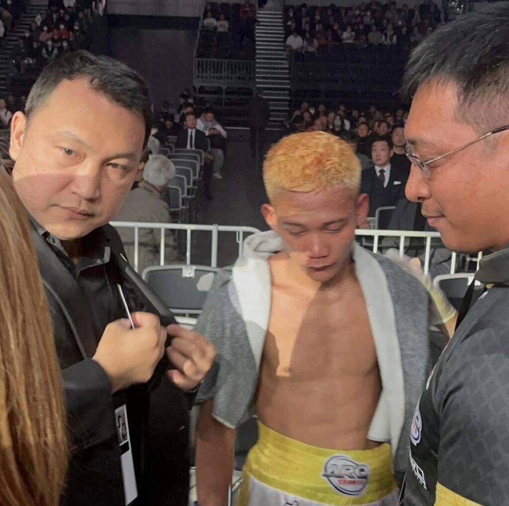 John Paul Gabunilas (middle) is accompanied by GAB Chairman Richard Clarin and his strength and conditioning trainer Roger Justine Potot after losing via a 5th round TKO against Kanamu Sakama of Japan.