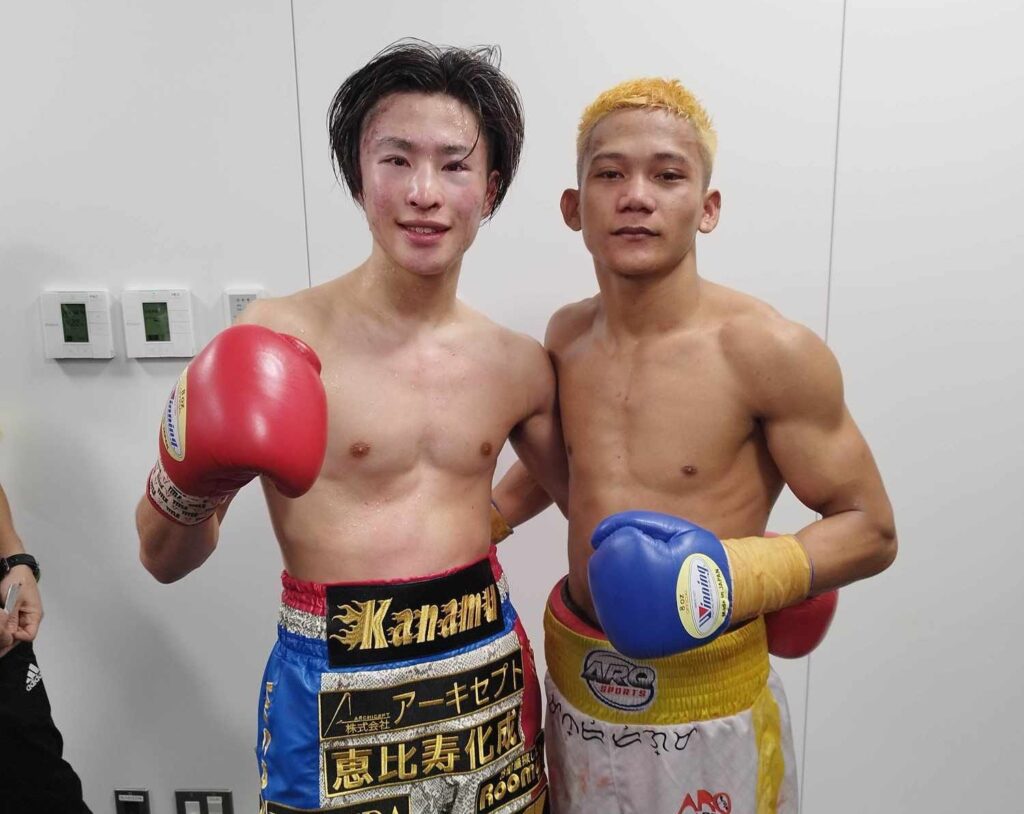 John Paul Gabunilas (right) and Kanamu Sakama (left) gamely pose for a photo together after their battle in the Inoue-Tapales undercard in Tokyo, Japan.