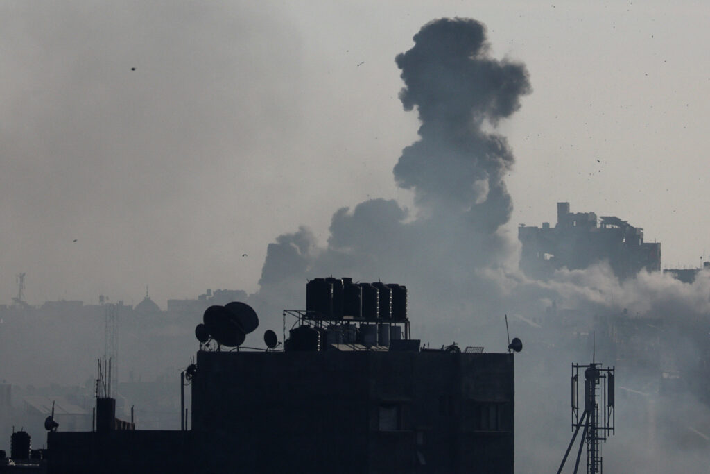 Israel tanks storm Khan Younis in new push in south Gaza. | Smoke rises after Israeli strikes, amid the ongoing conflict between Israel and the Palestinian Islamist group Hamas, in Khan Younis in the southern Gaza Strip, December 10, 2023. REUTERS/Ibraheem Abu Mustafa
