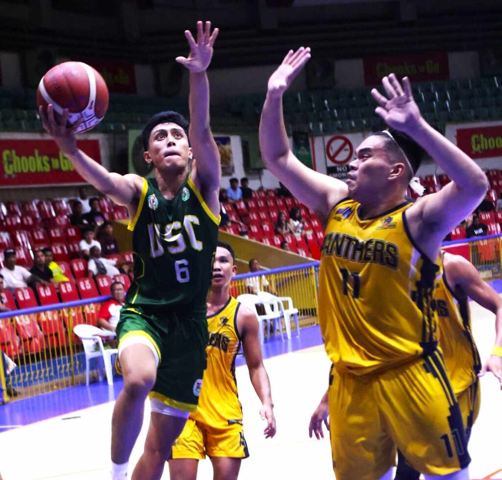 USC Warriors outlast USP-F Panthers in thrilling game for 3rd place in Cesafi season 23. USC's Yuriel Avila goes for a tough layup against USPF during their Cesafi men's basketball tournament Battle-for-Third. | Photo from Sugbuanong Kodaker