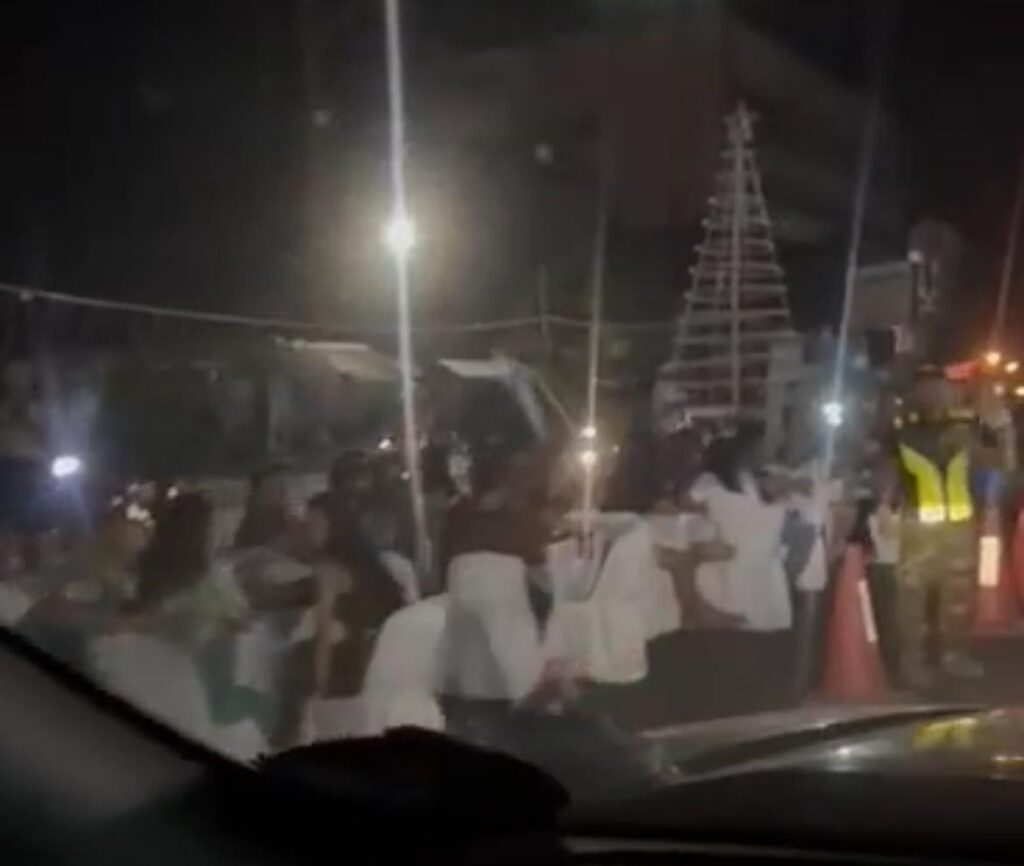 Christmas tree lighting activity in Bulacao causes traffic in Natalio Bacalso AVenue as guests and participants occupy a portion of the highway on Monday, December 3. | Screenshot from video of Nino Daculan
