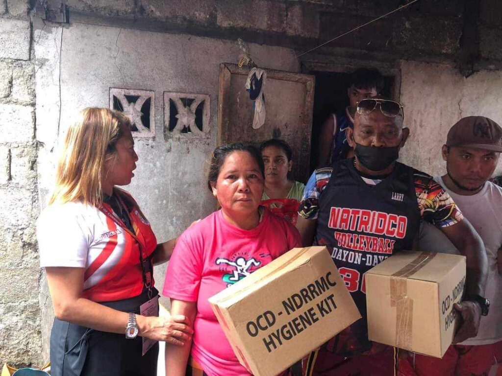Families who were affected by the fire that hit Barangay Catarman in Cordova town this morning, receive aid from the Cordova town government. | Futch Anthony Inso