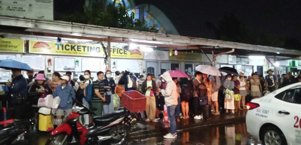Several flights, all sea trips in Cebu cancelled due to 'Kabayan'. These are some of the stranded passengers in Cebu City Pier 1 this morning, who queued hoping to get a ride to the provinces. | Paul Lauro