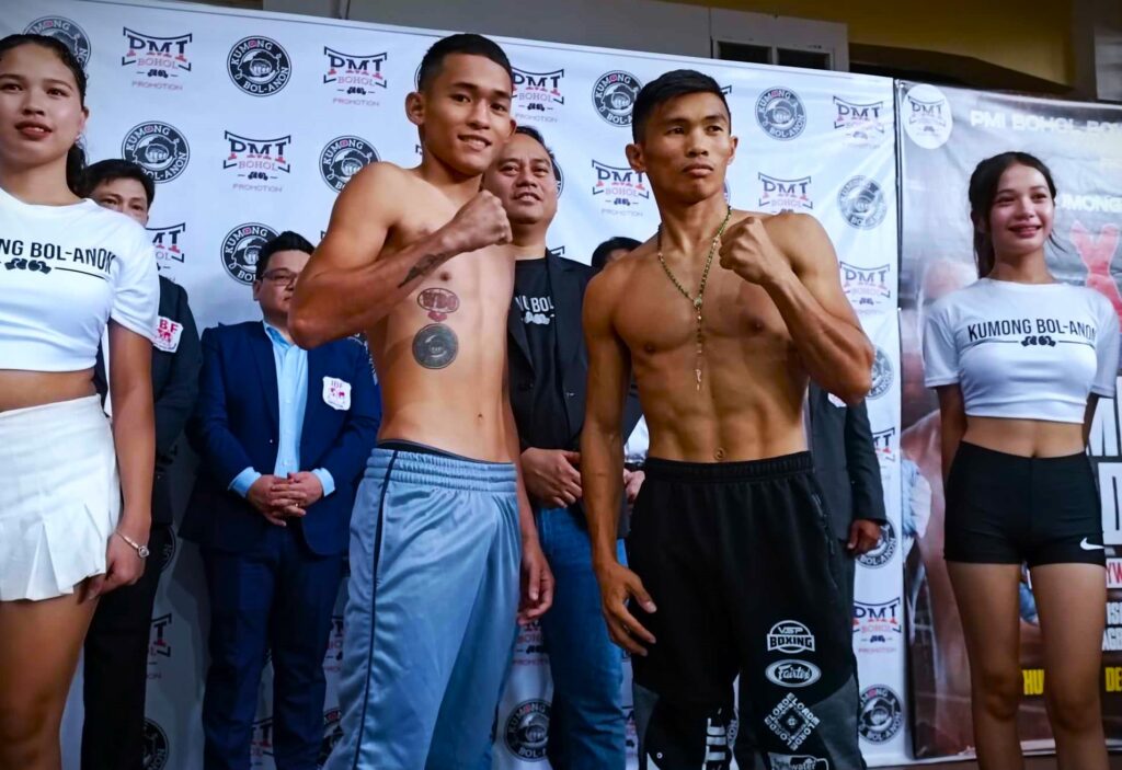 Jake Amparo (left) and Jake Taduran pose for the camera during the weigh-in for their IBF world minimumweight title eliminator in Tagbilaran City Bohol. Joining them was PMI Bohol Boxing Promotions manager and promoter Floriezyl Echavez Podot. | Glendale Rosal