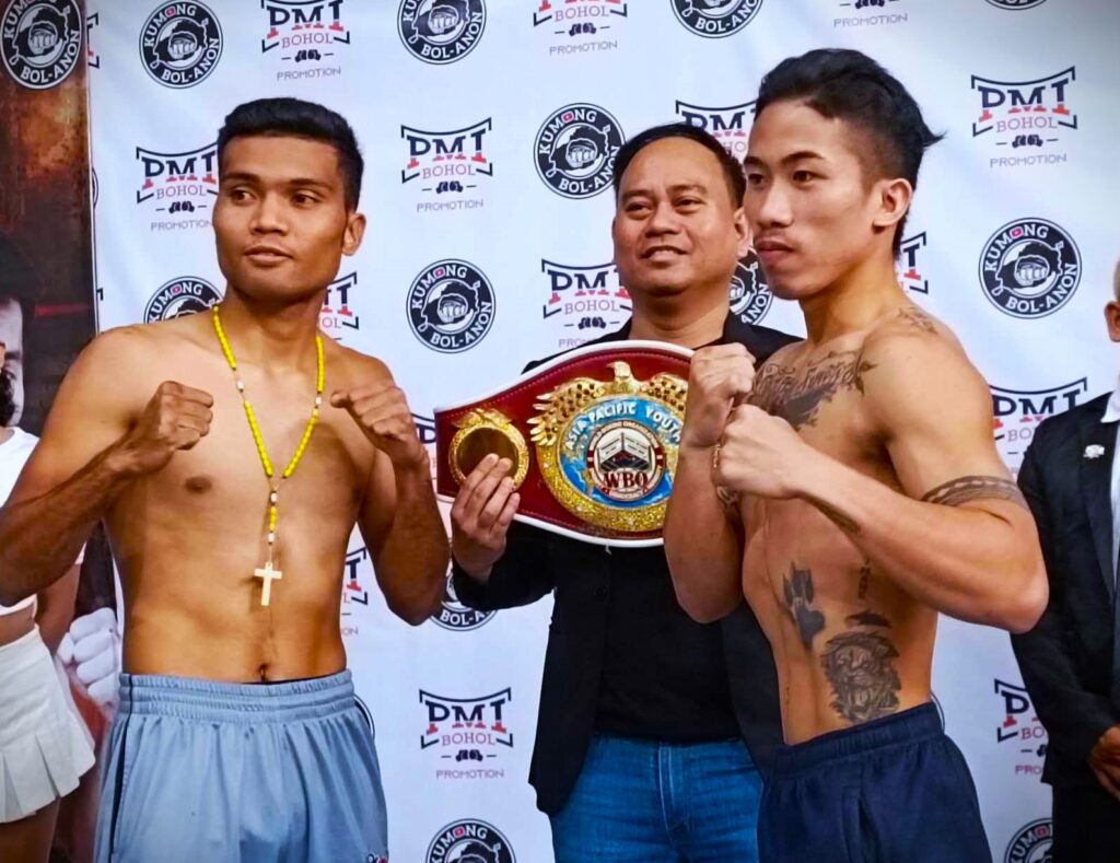 Amparo, Taduran lock horns for world title eliminator clash. Gerwin Asilo (left) and Aljum Pelesio strike a pose for their WBO Asia Pacific bantamweight title bout. Holding the title was PMI Bohol Boxing Promotions manager and promoter Floriezyl Echavez Podot. | Glendale Rosal