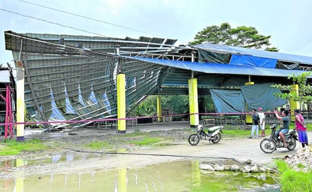 Explainer: Earthquake terms you need to know. SURIGAO DEL SUR QUAKE AFTERMATH. Part of a multipurpose building in Tagbina town in Surigao del Sur collapsed after a magnitude 7.4 earthquake struck on December 2, parts of eastern Mindanao includiing Surigao del Sur. (Photo by ERWIN MASCARIÑAS / Inquirer Mindanao)
