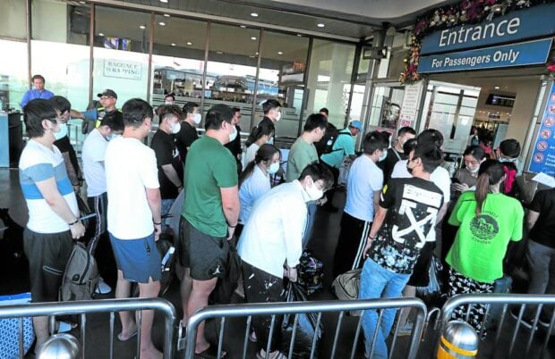 180 Chinese detained after anti-trafficking raid in Manila is deported. SENT HOME Thursday’s mass deportation involved Chinese nationals who were arrested in a raid on a Pasay City-based Philippine offshore gaming operator (Pogo) hub in October. They were found to have no working permits and engaged in “online scams.” Photo shows them lining up for predeparture procedures at Terminal 3 of Ninoy Aquino International Airport. —NIÑO JESUS ORBETA