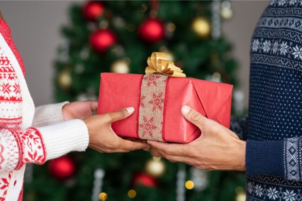 Survey shows that 1 of 4 Pinoy workers would rather monetize Christmas parties Photo is an.Inquirer.net stock photo of a Christmas gift.