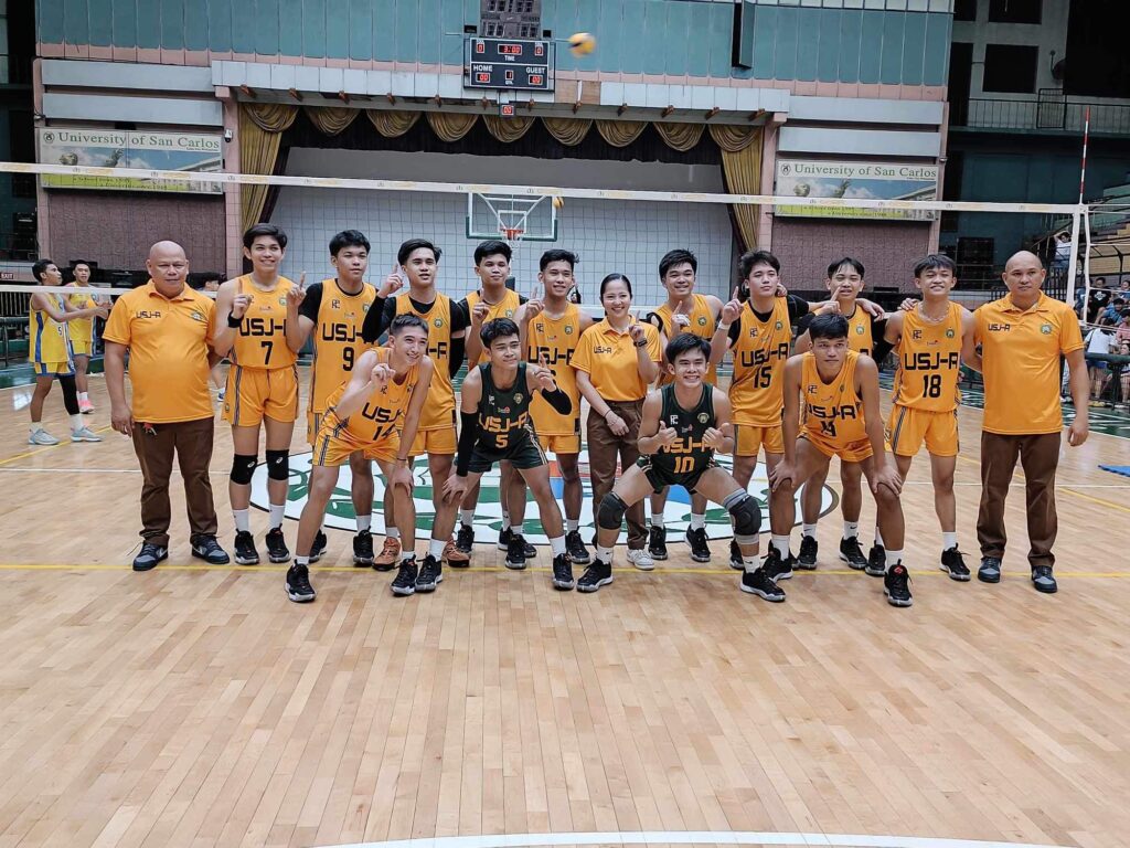 USJ-R Baby Jaguars boys volleyball team players and coaches pose for a group photo after their game in the Cesafi.