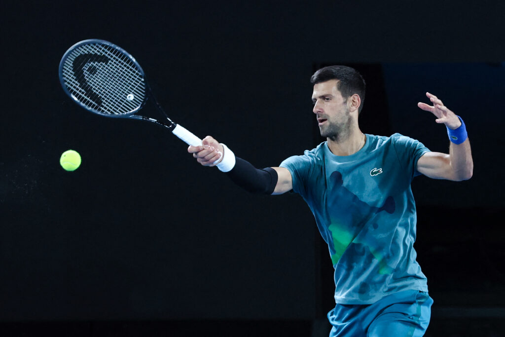 Tennis: Agassi anoints Djokovic as greatest ever. Serbia's Novak Djokovic hits a return during a practice session in Melbourne on January 13, 2024 ahead of the Australian Open tennis championship starting on January 14. | Photo by DAVID GRAY / AFP