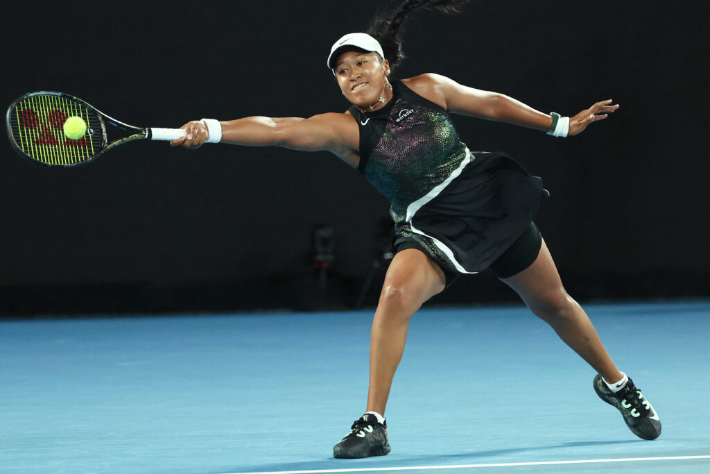 Australian Open Japan's Naomi Osaka hits a return against France's Caroline Garcia during their women's singles match on day two of the Australian Open tennis tournament in Melbourne on January 15, 2024. | AFP