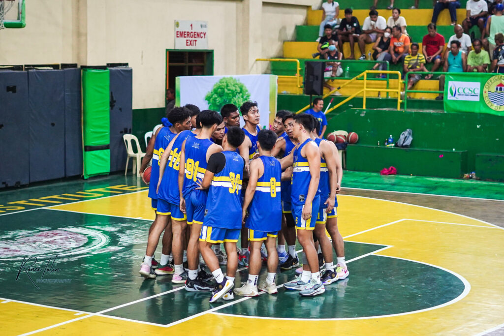 UC Webmasters players huddle up during their Sinulog Cup 2024 Basketball Tournament game.