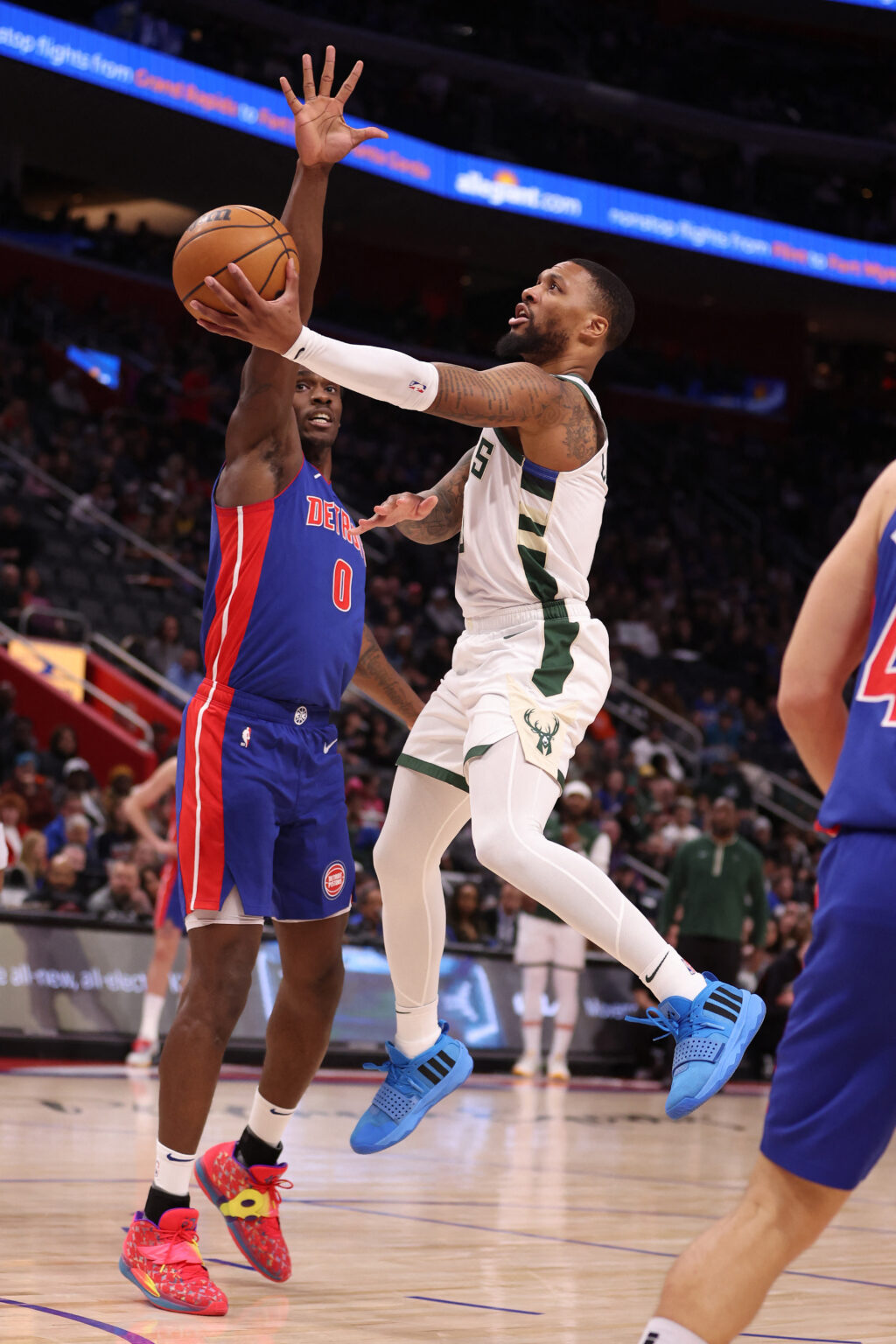NBA: Damian Lillard #0 of the Milwaukee Bucks drives to the basket around Jalen Duren #0 of the Detroit Pistons during the first half at Little Caesars Arena on January 20, 2024 in Detroit, Michigan. | GETTY IMAGES| AFP