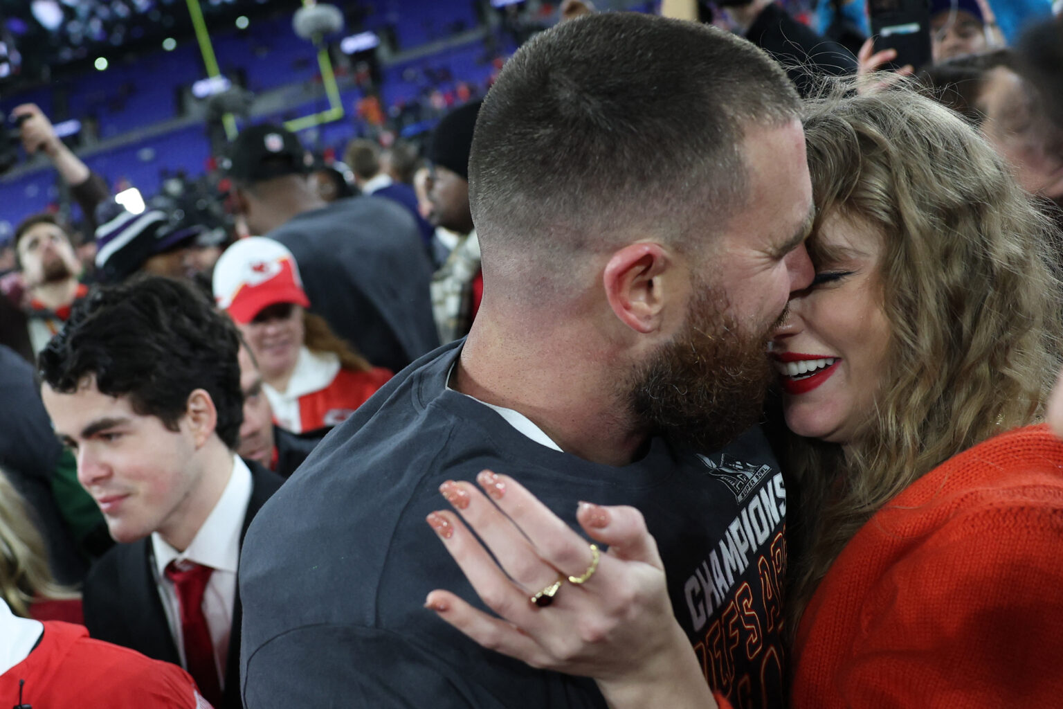 Taylor Swift greets Super Bowl-bound Travis Kelce with a kiss