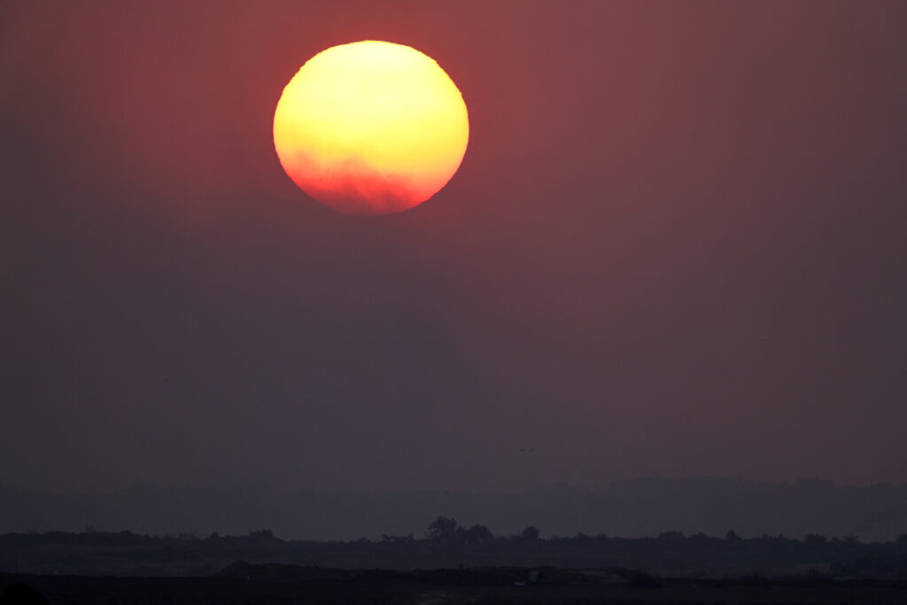 New Year. In photo is the sun setting on Gaza.