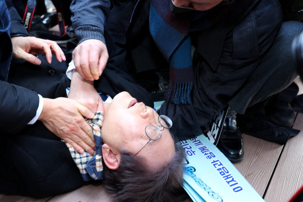 South Korea: opposition party leader Lee Jae-myung falls after being attacked by an unidentified man during his visit to Busan, South Korea, January 2, 2024.    Yonhap via REUTERS