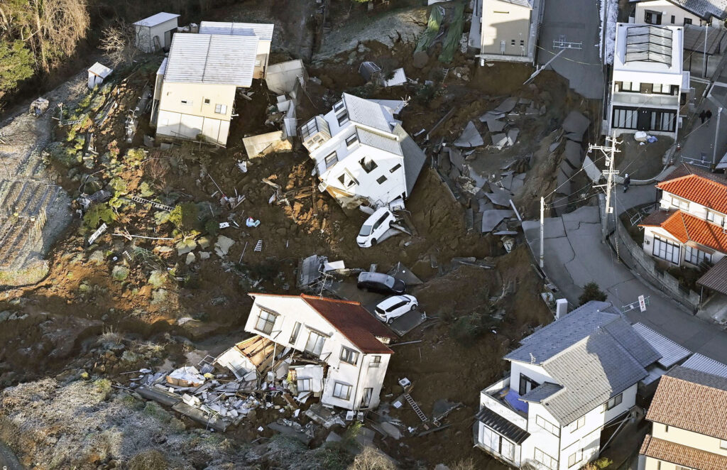 Japan earthquake toll hits 30. An aerial view shows collapsed houses, cars and roads caused by an earthquake in Kanazawa, Ishikawa prefecture, Japan January 2, 2024, in this photo released by Kyodo. | Kyodo/via REUTERS