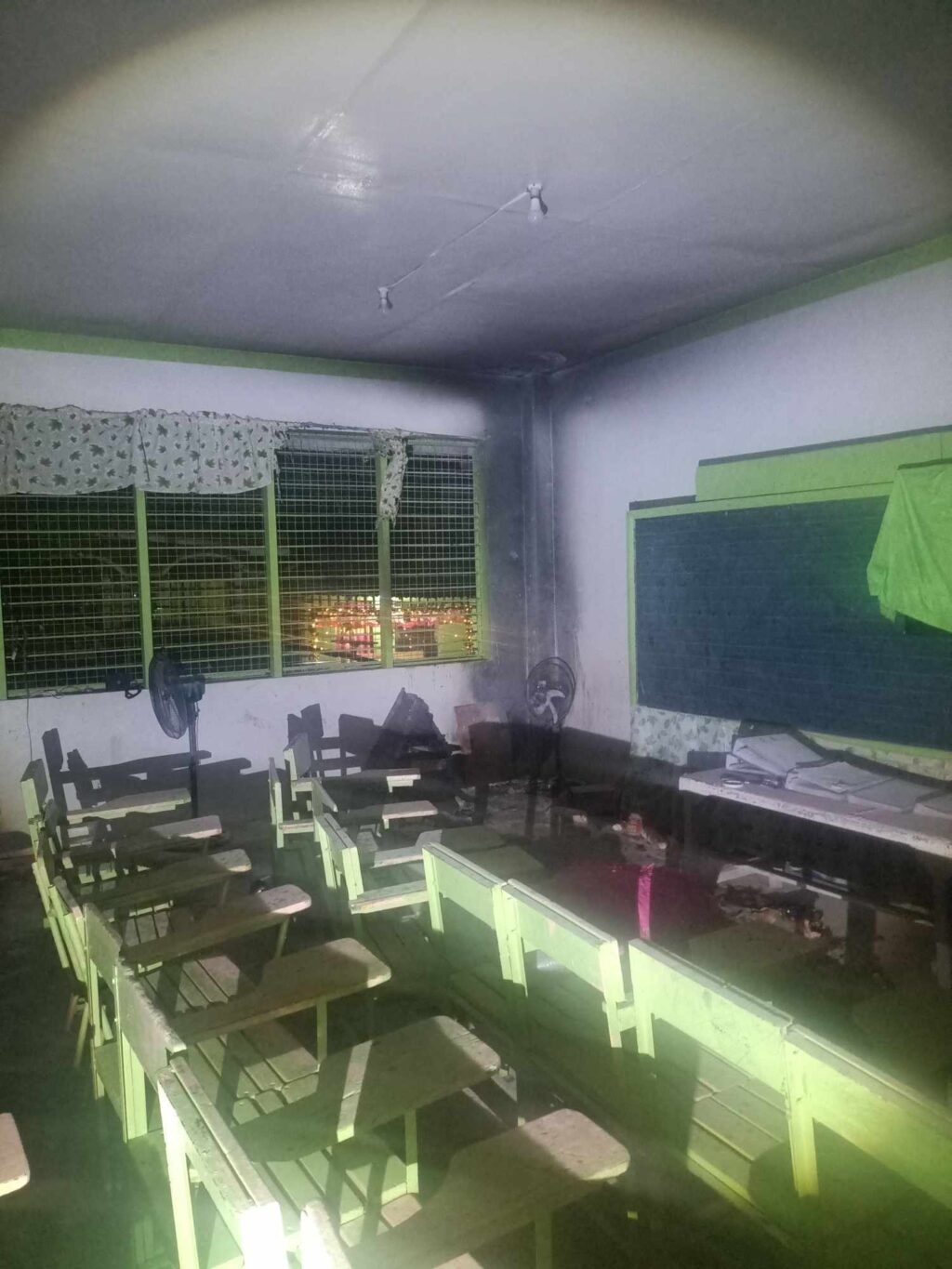 New Year's Day fires. A classroom from Pasil Elementary School got partially burned after a firecracker landed inside the classroom. | GMA Super Radyo via Futch Anthony Inso