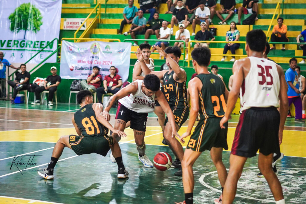 Jaguars bury Fighting Maroons in Sinulog Hoopla. In photo are players from USJ-R smothering Matt Flores of UP-Cebu with their defense during their Sinulog Cup 2024 Basketball Tournament game. | Photo from Ronex Tolin
