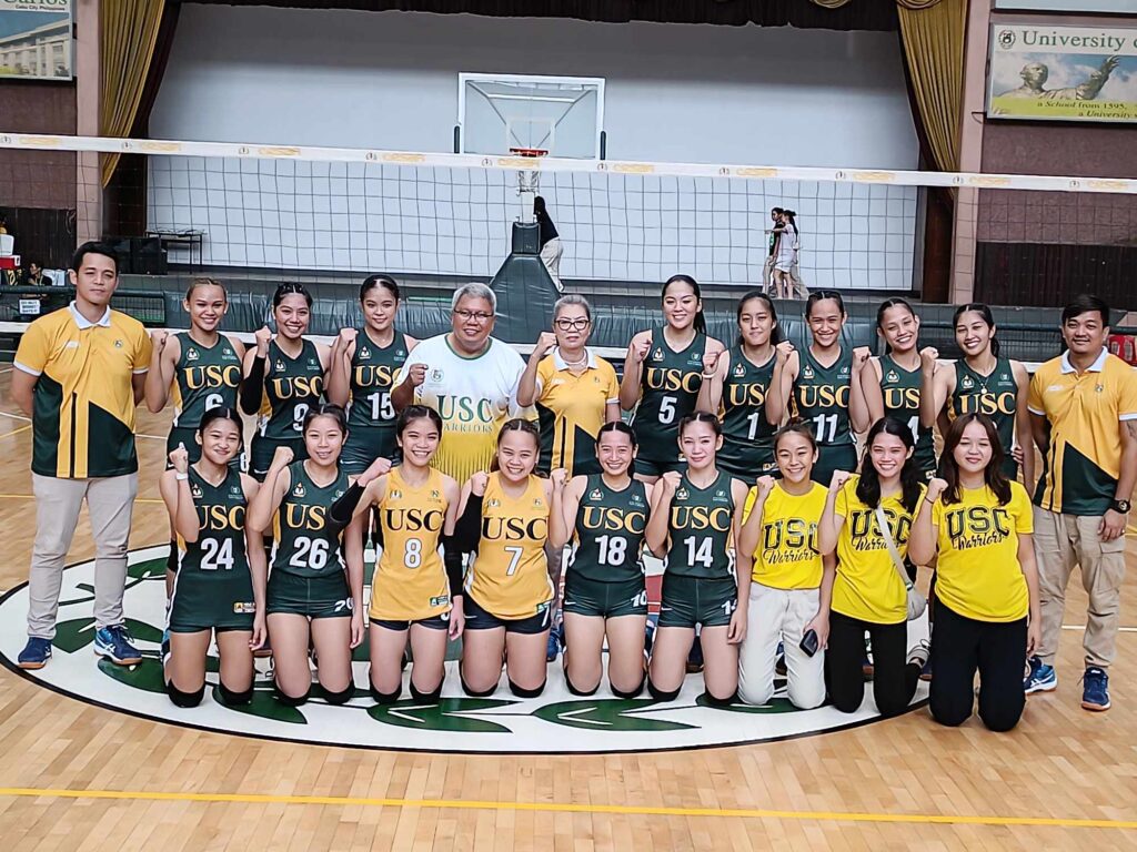 USC Lady Warriors players and team officials pose for a group photo after beating USPF in game one of the Cesafi women's volleyball finals. | Glendale Rosal