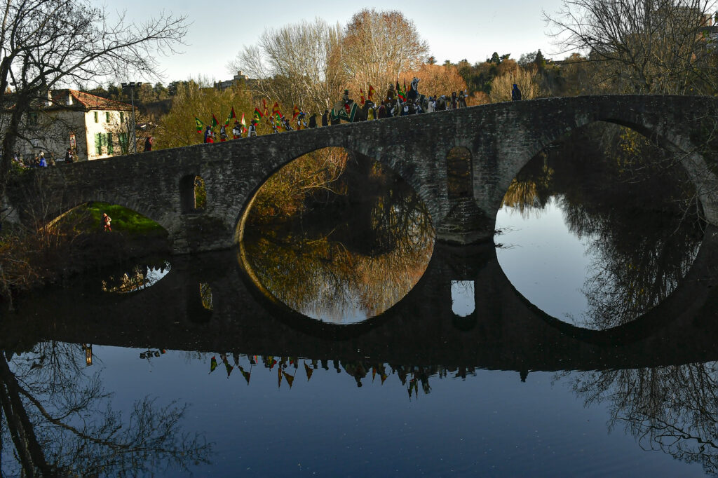 Three kings of The Cabalgata Los Reyes Magos (Cavalcade of the three kings) are reflected in the waters of the Arga River as they cross the ancient Magdalena bridge before to entrance in the old city during the cavalcade the day before Epiphany, in Pamplona, northern Spain, Thursday, Jan. 5, 2023. The parade symbolizes the coming of the Magi to Bethlehem following the birth of Jesus, marked in Spain and many Latin American countries Epiphany is the day when gifts are exchanged. (AP Photo/Alvaro Barrientos, File)