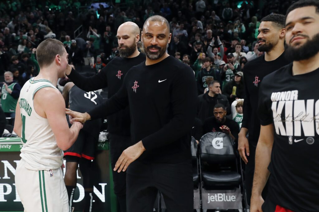 Celtics rout Udoka, Houston in Boston, Houston Rockets head coach Ime Udoka, center, leaves the court after speaking briefly with Boston Celtics' Payton Pritchard (11) following an NBA basketball game, Saturday, Jan. 13, 2024, in Boston. (AP Photo/Michael Dwyer)
