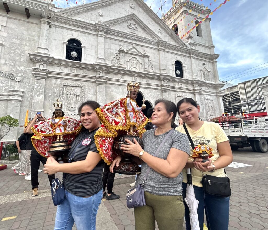 Sinulog Festival: Of families and their practices paying homage to Sto. Niño. In photo are the members of the Buntilao family holding their images of the Holy Child.