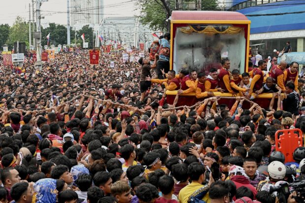 Nazareno devotees were estimated to be 1.3M at the Quirino Grandstand. In photo are Catholic devotees jostling with each other as they try to touch a glass-covered carriage carrying the Black Nazarene during an annual religious procession in Manila on January 9, 2024. | AFP