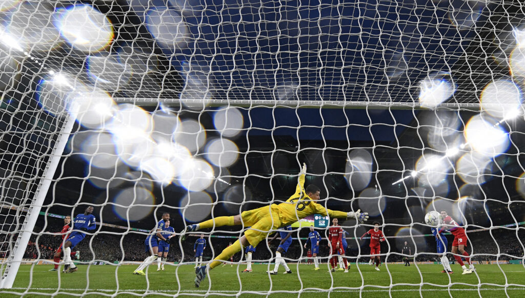 Liverpool win: Liverpool's Dutch defender #04 Virgil van Dijk (right) scores the winning goal past Chelsea's Serbian goalkeeper #28 Djordje Petrovic, in extra time during the English League Cup final football match between Chelsea and Liverpool at Wembley stadium, in London, on February 25, 2024. | AFP