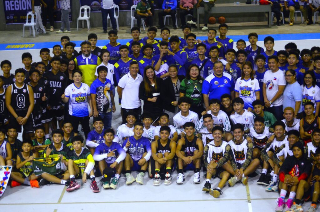 Officials, players, and coaches pose for a group photo during the opening ceremony of the BPBL Season 2 Central Visayas finals on Friday, February 2, at the  Municipality of Carmen Sports and Activity Center.