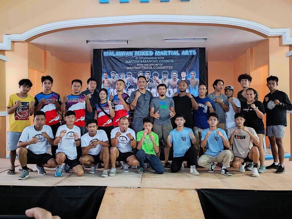 The fighters and organizers of the "Karambola" Mixed Martial Arts (MMA) fight card pose for photos during a presser at the Mactan Sports Complex on Saturday, February 10, 2024.