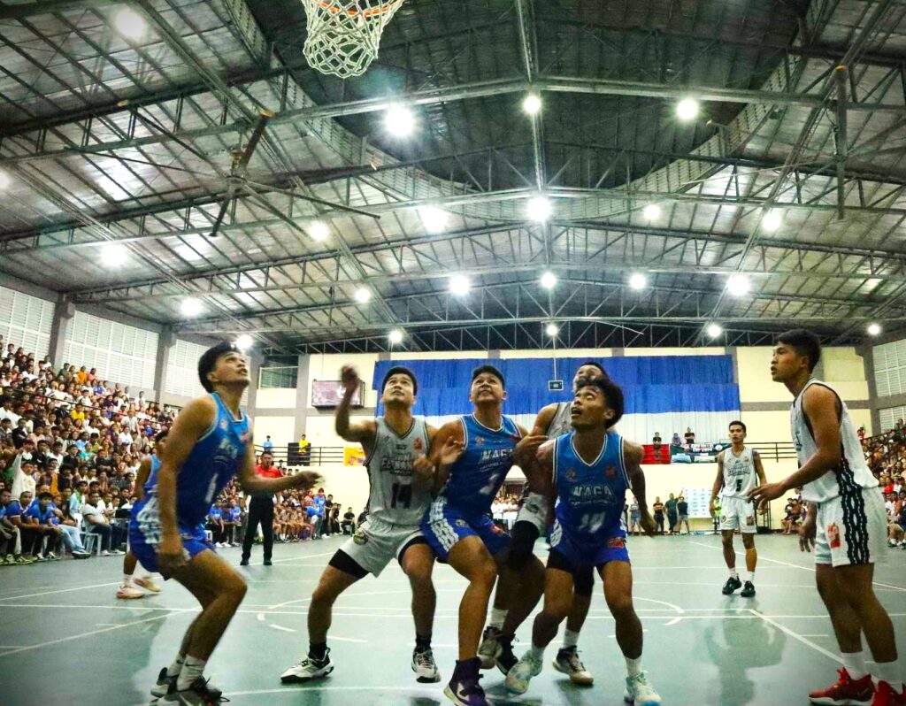 Players of Naga Atong Garbo and San Fernando Buffalos battle for a rebound during their Rhea Gullas Cup 2024 basketball game on Saturday. 