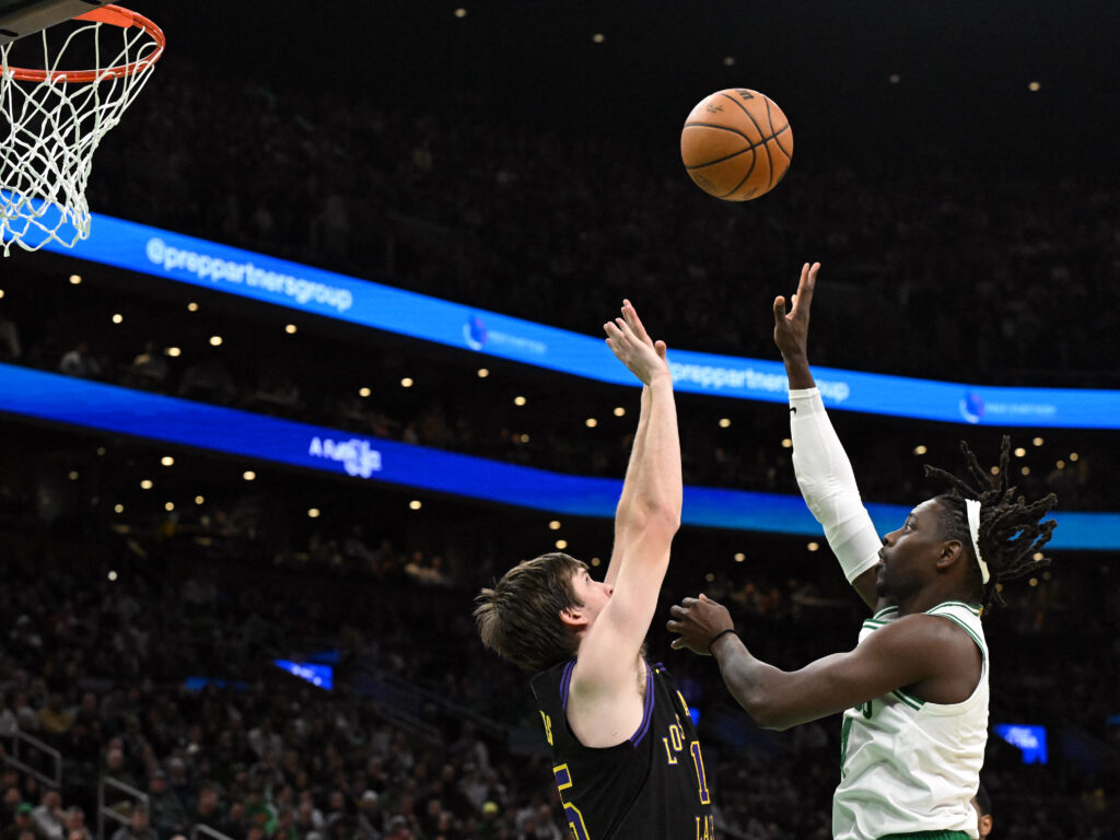 NBA: Lakers overcome absence of Lebron, AD with 114-105 win over Celtics. Jrue Holiday #4 of the Boston Celtics attempts a basket against Austin Reaves #15 of the Los Angeles Lakers during the fourth quarter at the TD Garden on February 01, 2024 in Boston, Massachusetts. | Getty Images via AFP