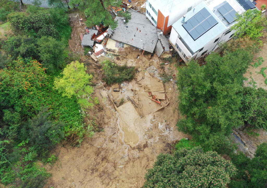 Los Angeles records 400 mudslides. This is an aerial view of a home destroyed by a mudslide as a powerful long-duration atmospheric river storm, the second in less than a week, continues to impact Southern California on February 5, 2024 in Los Angeles, California. | Mario Tama/Getty Images/AFP