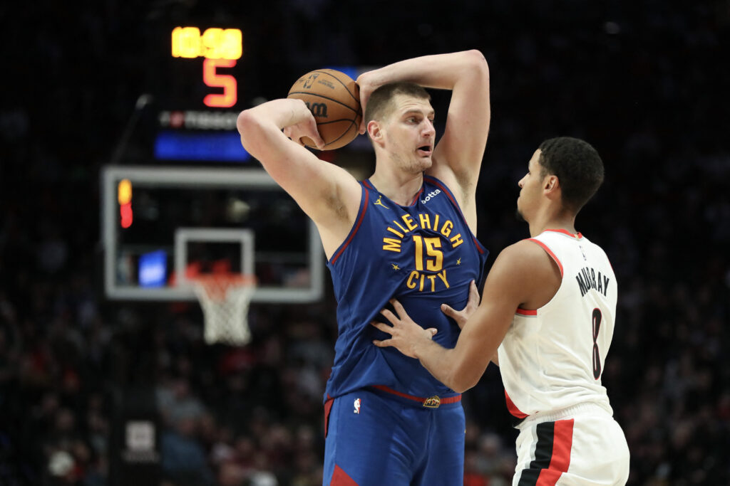 NBA: Jokic leads Denver Nuggets to a win against Golden State Warriors.  Nikola Jokic #15 of the Denver Nuggets looks to pass away from Kris Murray #8 of the Portland Trail Blazers during the third quarter at Moda Center on February 23, 2024 in Portland, Oregon. | Getty Images via AFP