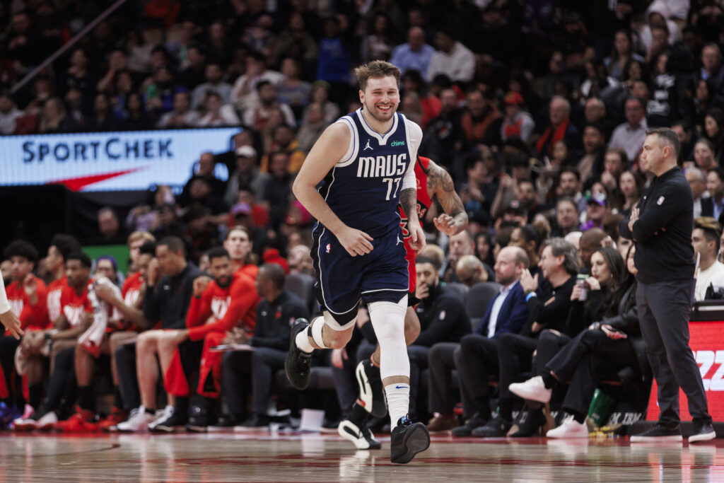 NBA: DONCIC GETs 11th triple double of season. Luka Doncic #77 of the Dallas Mavericks smiles as he runs back on defense against the Toronto Raptors in the second half of their NBA game at Scotiabank Arena on February 28, 2024 in Toronto, Canada. | Getty Images via AFP