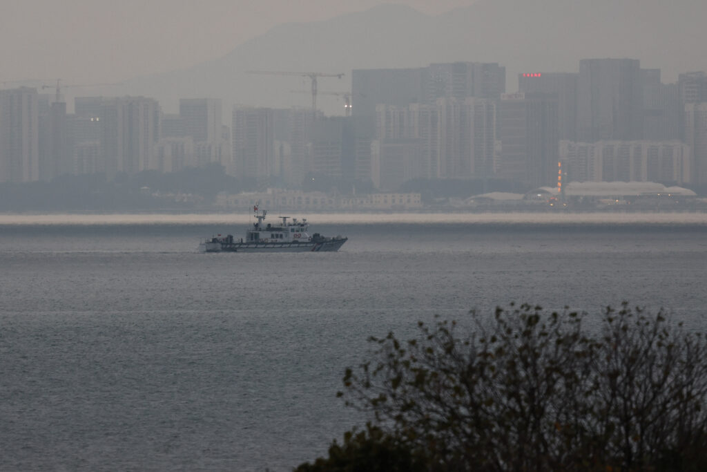 Taiwan drives away Chinese coast guard boat as frontline island tensions rise. A fishing boat can be seen between Kinmen and Xiamen in China in Kinemn, Taiwan February 20, 2024. REUTERS/Ann Wang