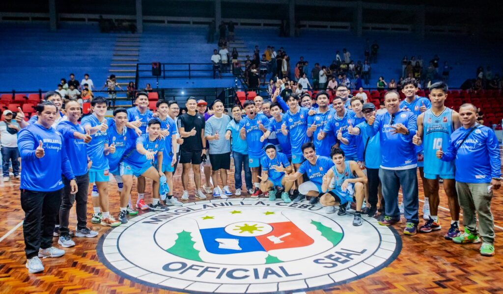 Minglanilla wins. Abante Minglanilla's players, coaches, and the Municipality of Minglanilla mayor Rajiv Enad (in striped shirt) pose for a group photo after beating San Fernando in the Rhea Gullas Cup. | Photo from Mayor Rajiv Enad's Facebook page