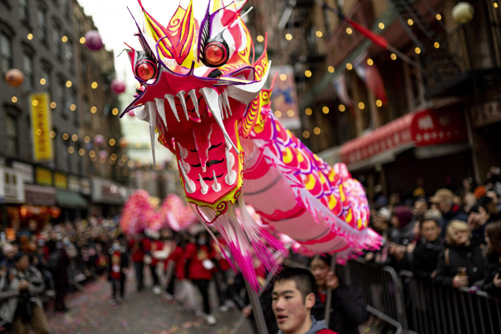 Chinese New Year 2024. FILE - Revelers celebrate Lunar New Year in Manhattan's Chinatown, Feb. 12, 2023, in New York. On Feb. 10, 2024 Asian American communities around the U.S. will ring in the Year of the Dragon with community carnivals, family gatherings, parades, traditional food, fireworks and other festivities. [AP Photo file)