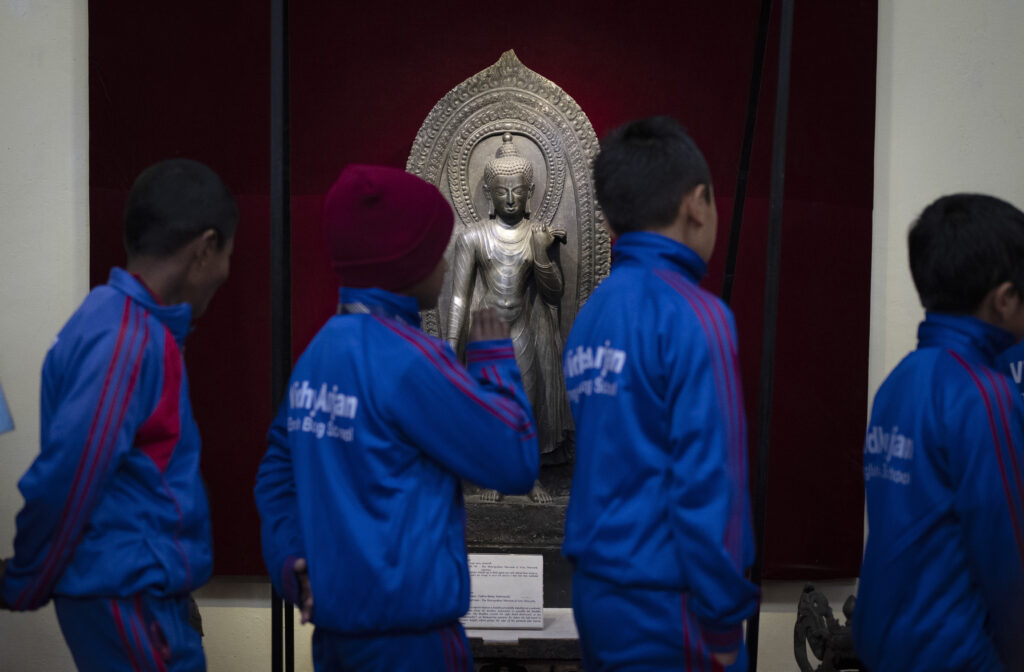 Nepal. School children look at a statue of Lord Buddha stolen earlier from Nepal and brought back from New York's metropolitan museum of art, as the same is displayed at the National Museum in Kathmandu, Nepal, Jan. 3, 2024. An unknown number of sacred statues of Hindu deities were stolen and smuggled abroad in the past. Now dozens are being repatriated to the Himalayan nation, part of a growing global effort to return such items to countries in Asia, Africa and elsewhere. (AP Photo/Niranjan Shrestha)