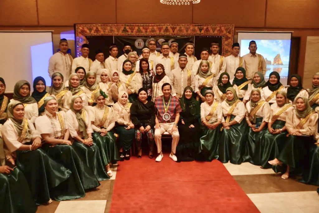 Cebu City Mayor Michael Rama, seated at the center, posed for a photo with the participants of Shari'ah Training Seminar inside an event hall of a hotel 