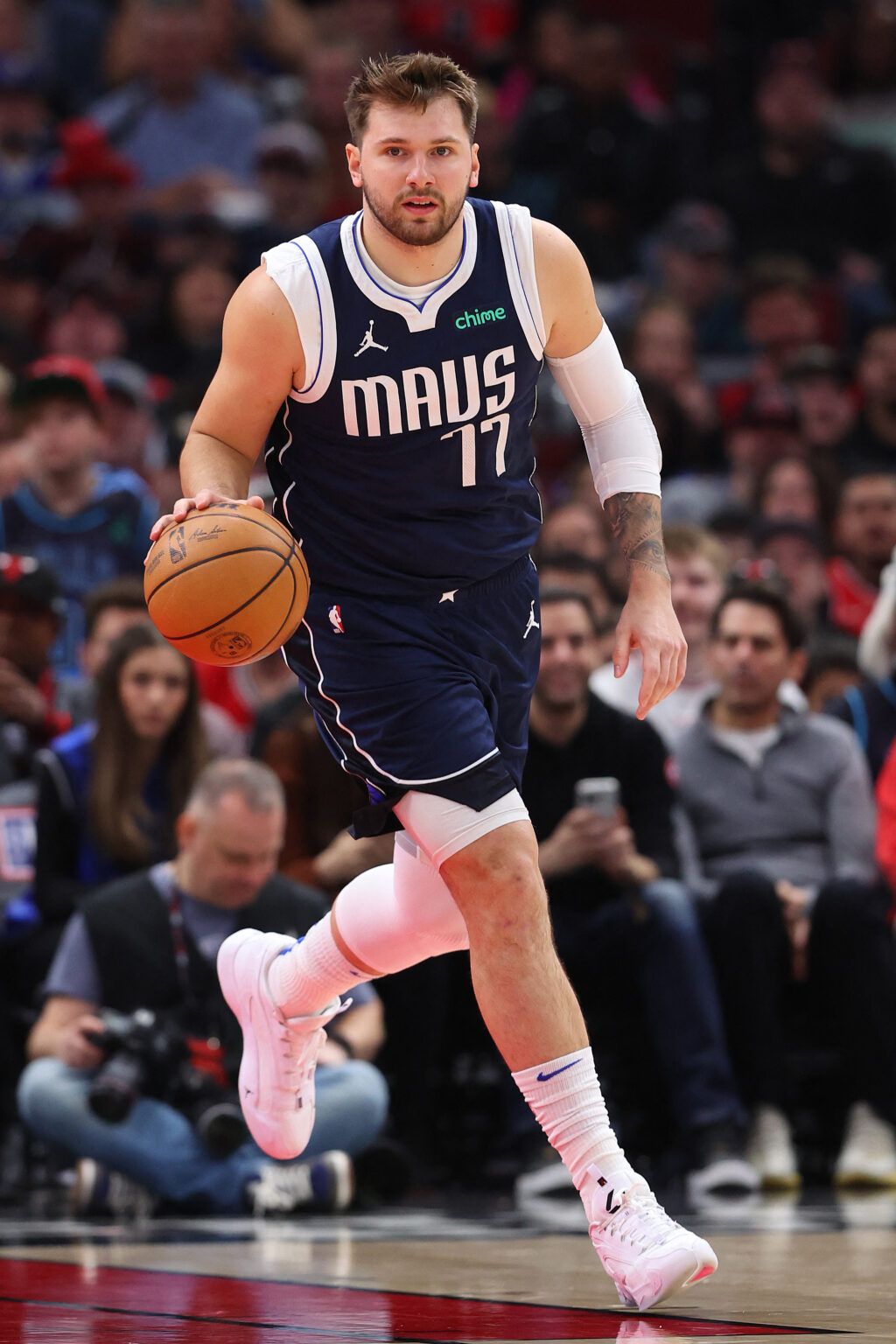 Luka Doncic #77 of the Dallas Mavericks dribbles up the court against the Chicago Bulls during the first half at the United Center on March 11, 2024 in Chicago, Illinois. | Getty Images via AFP