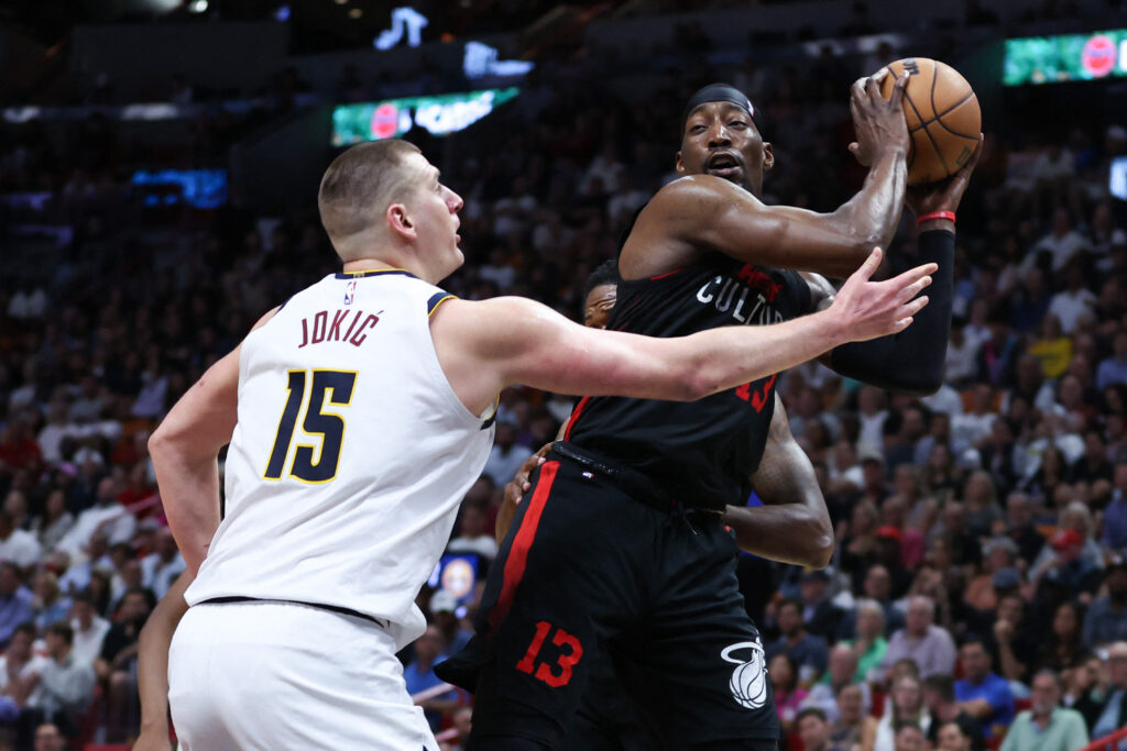 Bam Adebayo #13 of the Miami Heat rebounds the ball against Nikola Jokic #15 of the Denver Nuggets during the second quarter of the game at Kaseya Center on March 13, 2024 in Miami, Florida. | Getty Images via AFP